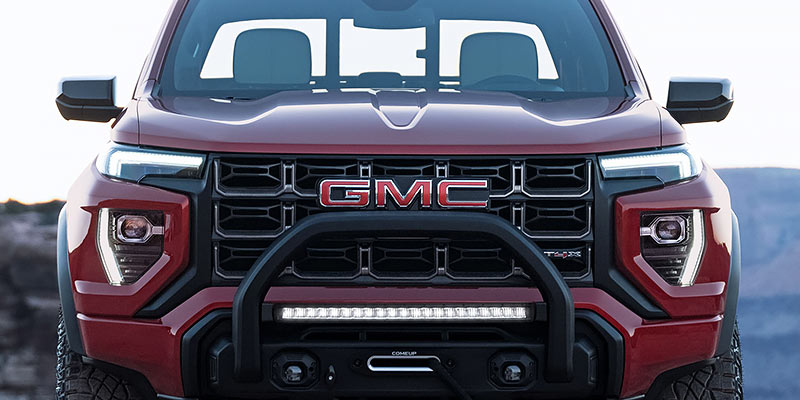 Front angled close up of a red 2025 GMC Canyon truck.